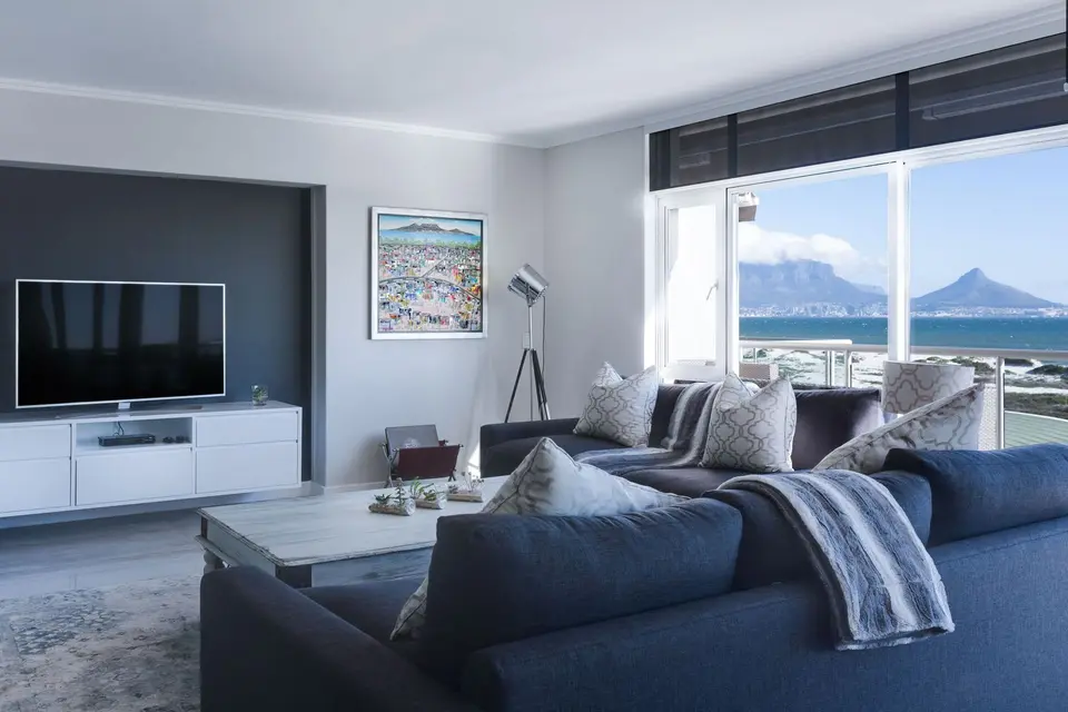 Living room with a view of mountains through the windows