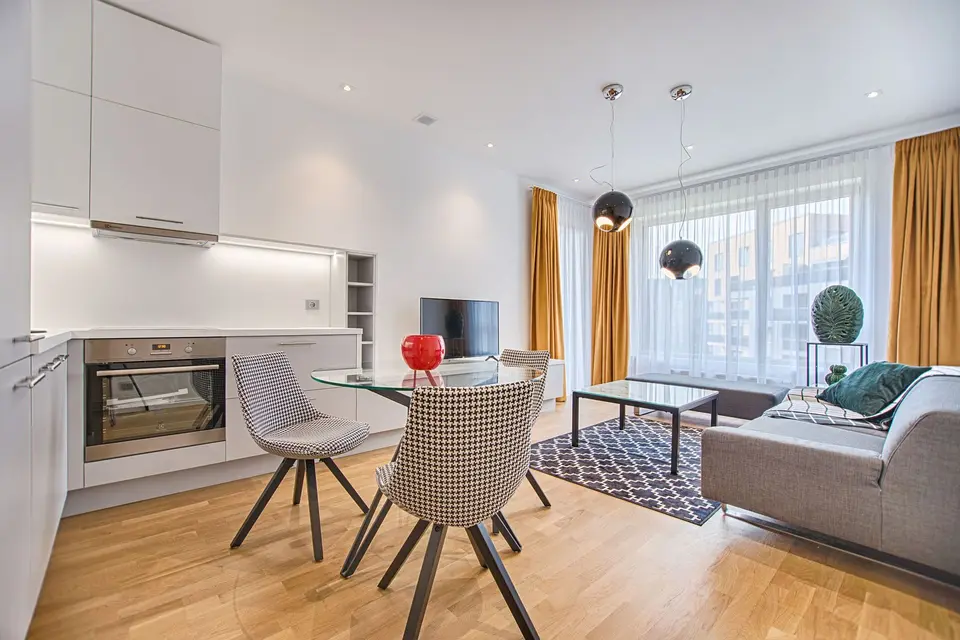 Scandinavian living room opening onto a kitchen