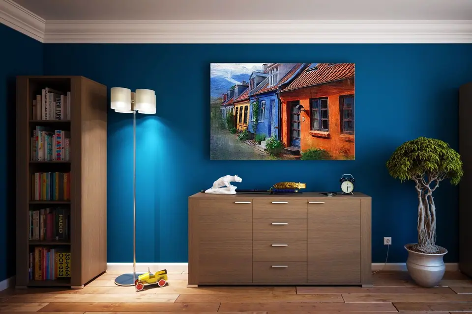 Living room with bookshelves and a colorful painting